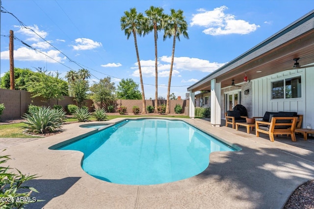 view of swimming pool with ceiling fan, outdoor lounge area, a patio, a fenced backyard, and french doors