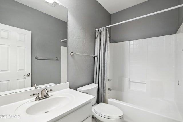 full bathroom with vanity, visible vents, toilet, and shower / bath combo with shower curtain