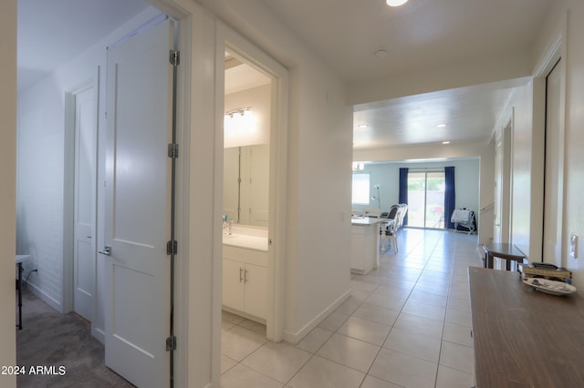 corridor with light tile patterned flooring