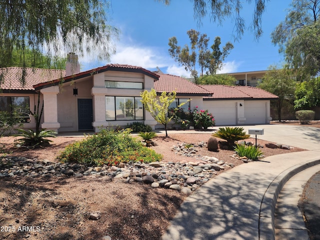 2105 W Terrace Dr, Wickenburg, AZ 85390 - view of front of property with a garage, stucco siding, a chimney, concrete driveway, and a tile roof