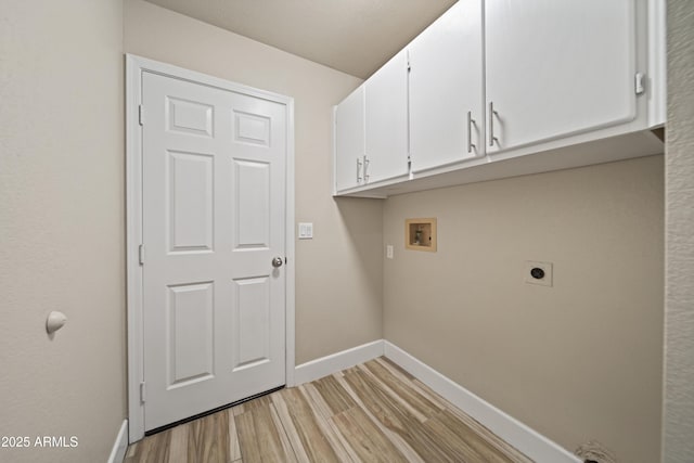 2105 W Terrace Dr, Wickenburg, AZ 85390 - washroom with electric dryer hookup, cabinet space, washer hookup, light wood-type flooring, and baseboards