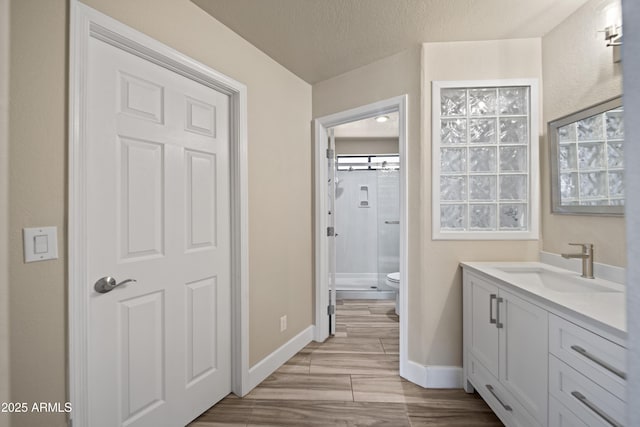 2105 W Terrace Dr, Wickenburg, AZ 85390 - full bath with walk in shower, vanity, baseboards, and wood finished floors