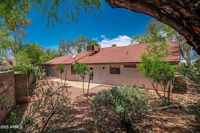 2105 W Terrace Dr, Wickenburg, AZ 85390 - rear view of property with a chimney, central air condition unit, a patio area, stucco siding, and a tile roof