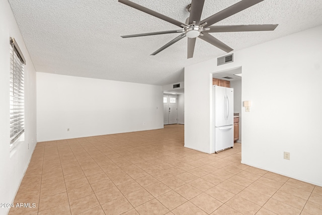 unfurnished living room featuring light tile patterned flooring, a textured ceiling, and ceiling fan