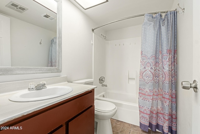 full bathroom featuring tile patterned flooring, vanity, toilet, and shower / bathtub combination with curtain