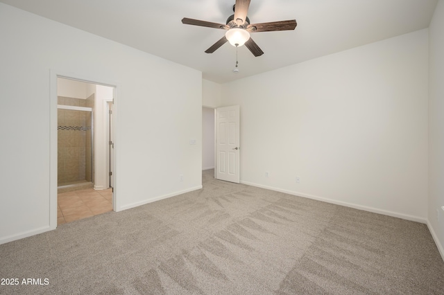 unfurnished bedroom featuring a ceiling fan, carpet flooring, connected bathroom, and baseboards