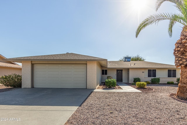 ranch-style home featuring a garage