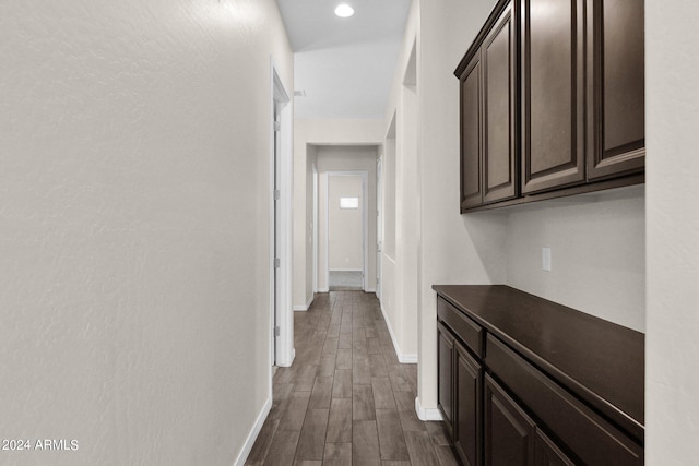 hall with dark hardwood / wood-style flooring