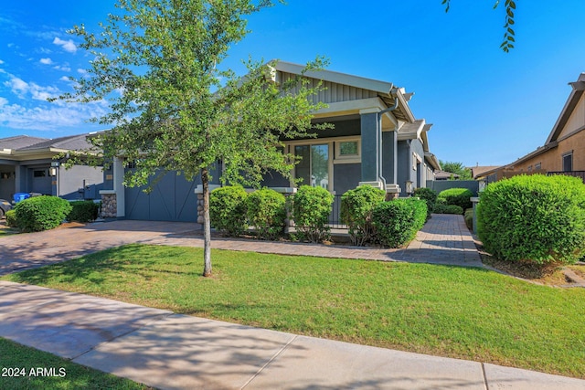 view of front facade with a garage and a front lawn