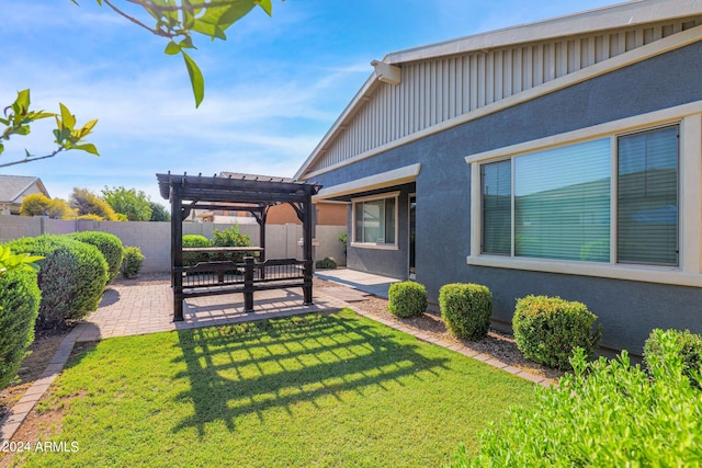 view of yard with a patio area and a pergola