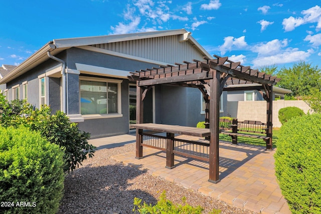 exterior space with a patio area and a pergola