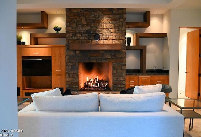 living room featuring a fireplace