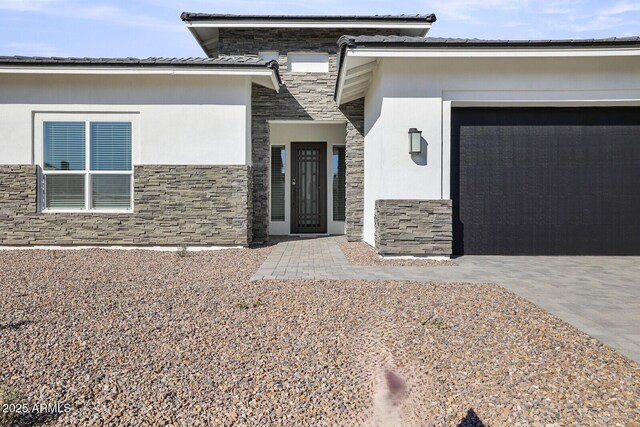 property entrance featuring a garage