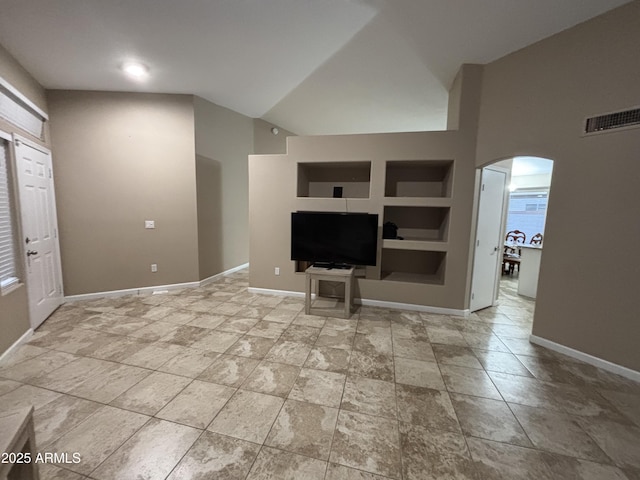 living area with visible vents, high vaulted ceiling, built in features, arched walkways, and baseboards