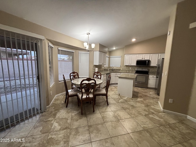 dining room featuring lofted ceiling, a notable chandelier, recessed lighting, and baseboards