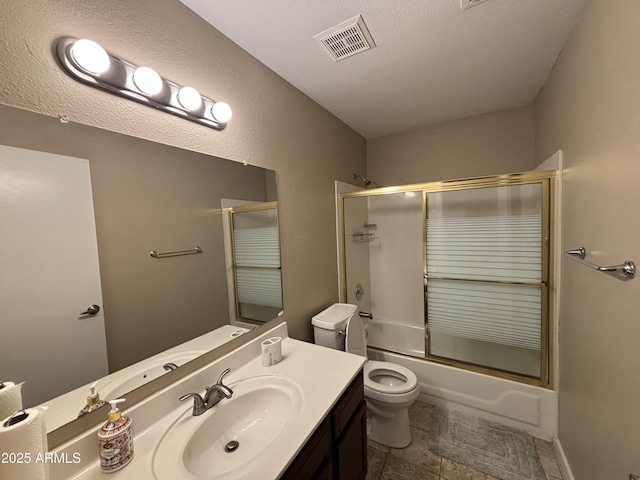 bathroom with vanity, visible vents, enclosed tub / shower combo, a textured ceiling, and toilet