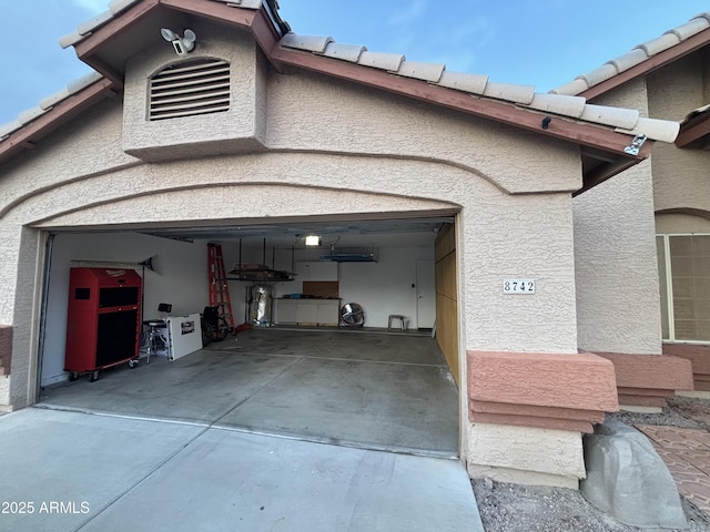 garage featuring driveway