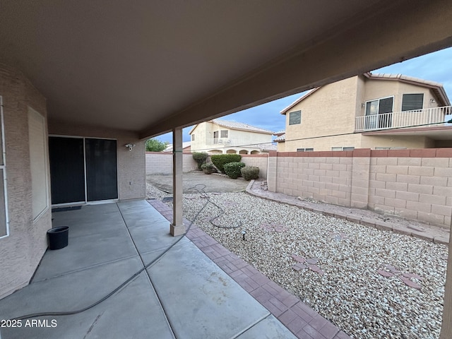 view of patio / terrace featuring fence