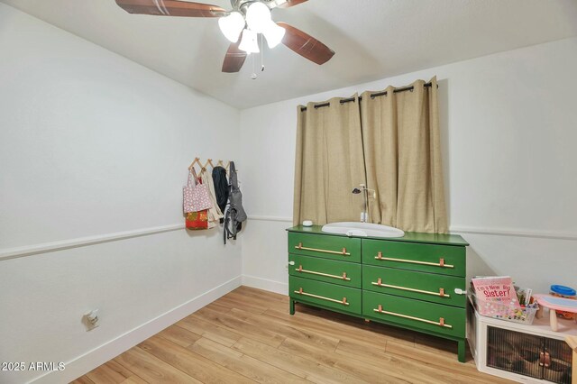 623 W Guadalupe Rd Unit 213, Mesa, AZ 85210 - bedroom featuring baseboards, a ceiling fan, and light wood-style flooring