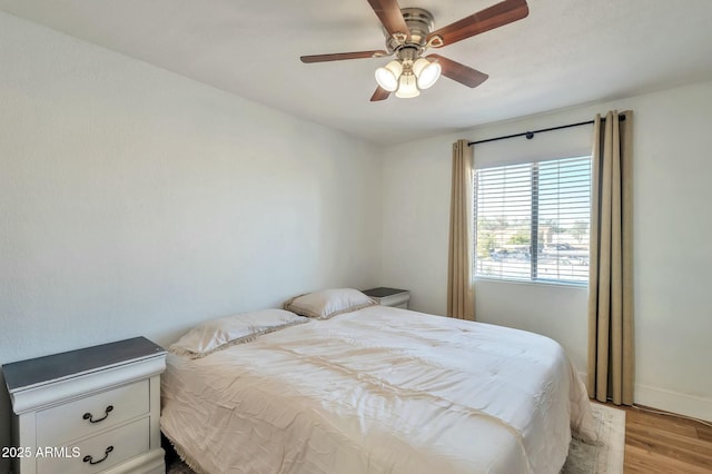 623 W Guadalupe Rd Unit 213, Mesa, AZ 85210 - bedroom with ceiling fan, baseboards, and light wood-style floors