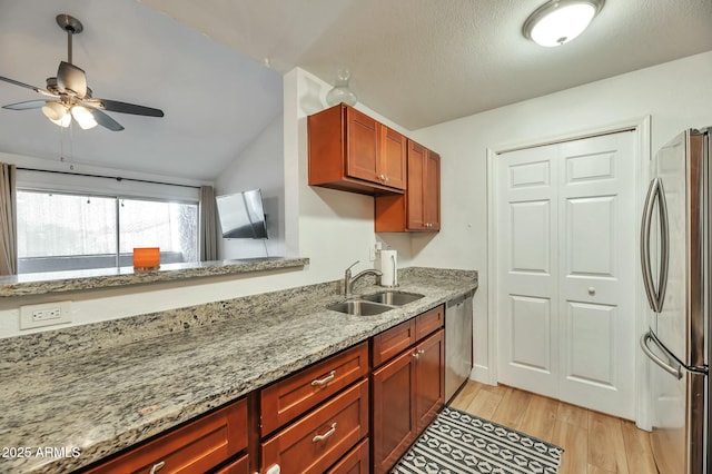 623 W Guadalupe Rd Unit 213, Mesa, AZ 85210 - kitchen featuring a ceiling fan, a sink, light wood-style flooring, appliances with stainless steel finishes, and light stone countertops