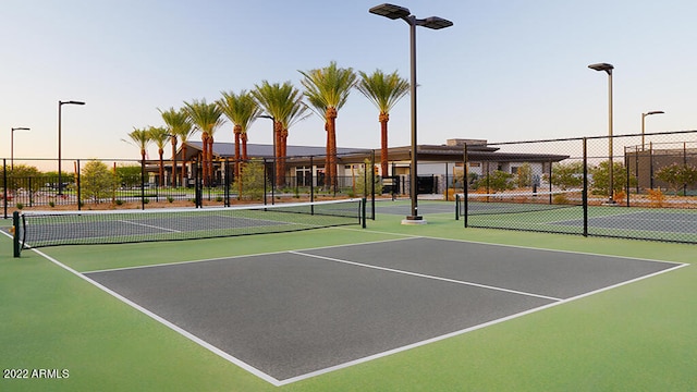 view of tennis court featuring basketball court