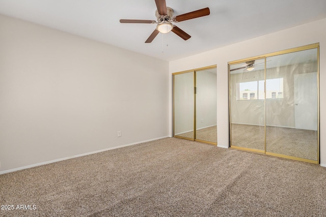 222 W Brown Rd Unit 14, Mesa, AZ 85201 - unfurnished bedroom featuring multiple closets, carpet floors, and a ceiling fan