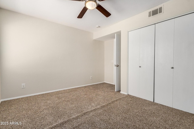 222 W Brown Rd Unit 14, Mesa, AZ 85201 - unfurnished bedroom with carpet, a closet, and a ceiling fan