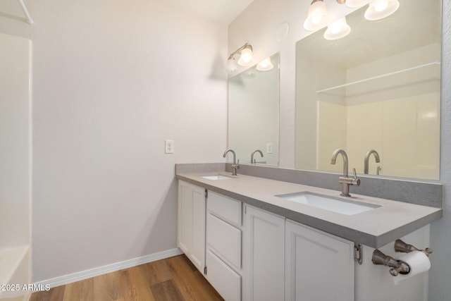 222 W Brown Rd Unit 14, Mesa, AZ 85201 - full bathroom featuring wood finished floors, double vanity, and a shower
