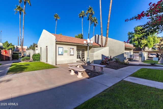 222 W Brown Rd Unit 14, Mesa, AZ 85201 - view of front facade featuring stucco siding, a tile roof, and a patio