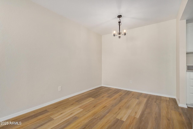 222 W Brown Rd Unit 14, Mesa, AZ 85201 - unfurnished dining area featuring a chandelier and light wood-style flooring