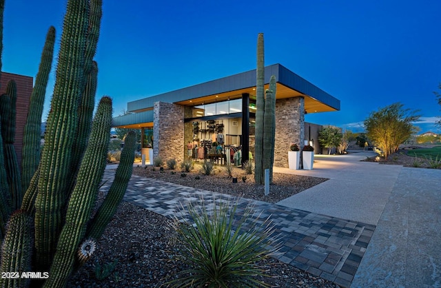 view of property exterior at dusk