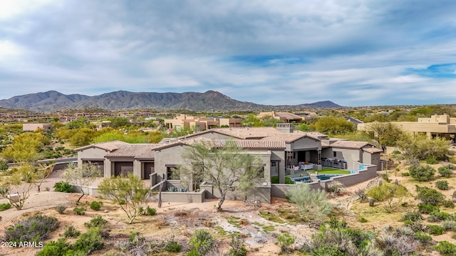 back of property featuring a mountain view