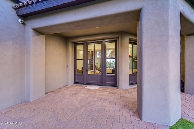 entrance to property featuring french doors