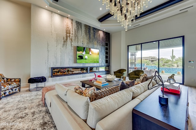 living room featuring a notable chandelier and hardwood / wood-style flooring