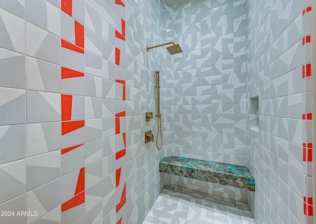 bathroom featuring tiled shower