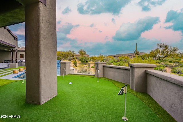 view of yard at dusk