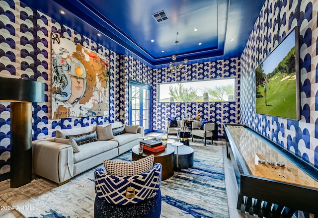 living room with a tray ceiling