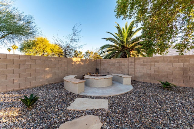 view of yard with a patio and an outdoor fire pit