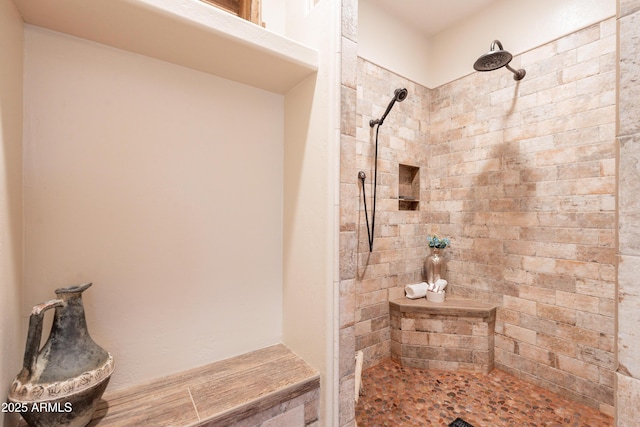full bath with tiled shower