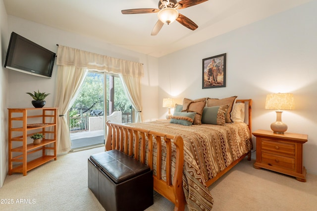 carpeted bedroom with access to outside and a ceiling fan