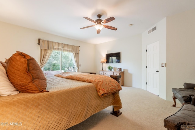 carpeted bedroom featuring ceiling fan, access to exterior, and visible vents