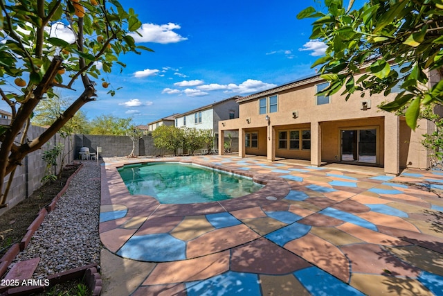 view of swimming pool with a patio area, a fenced backyard, and a fenced in pool