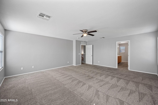 interior space featuring carpet, visible vents, and baseboards