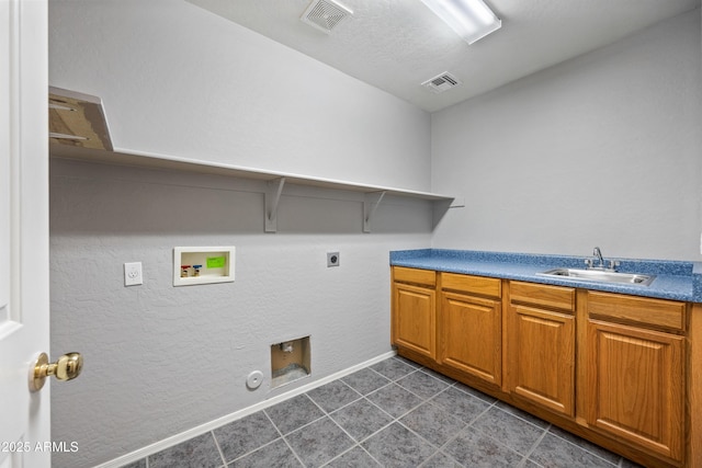 laundry area featuring visible vents, gas dryer hookup, a sink, hookup for a washing machine, and electric dryer hookup