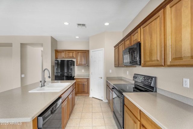 kitchen featuring visible vents, recessed lighting, a sink, black appliances, and light countertops