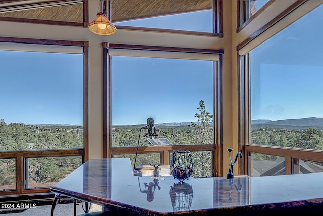 sunroom with a mountain view