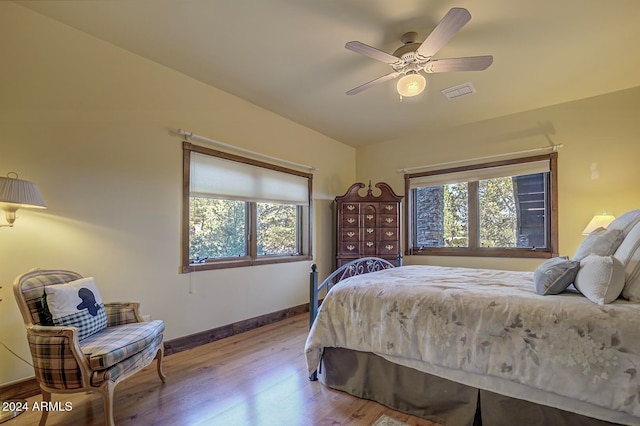 bedroom with light hardwood / wood-style flooring and ceiling fan