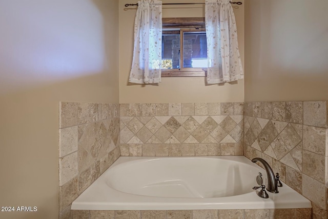 bathroom with a relaxing tiled tub