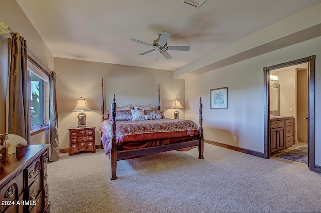 carpeted bedroom featuring connected bathroom and ceiling fan